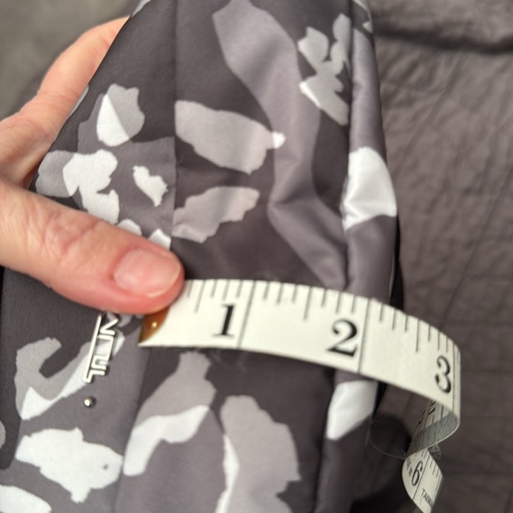 Tumi. New without tags. Endless pockets. - Picture 10 of 10